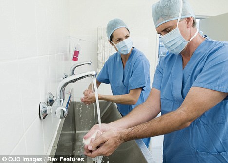 Surgeons+in+short+sleeves+washing+hands+before+operation.jpg